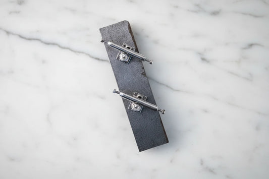 Silver fingerboard trucks without wheels