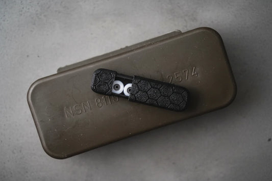 White ABS fingerboard wheels on black casing for transportation.