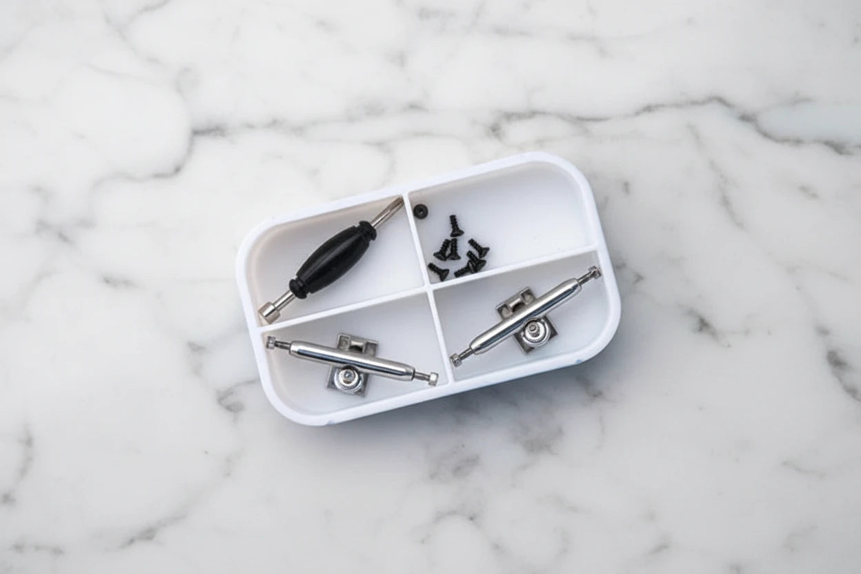 Silver fingerboard trucks with tools
